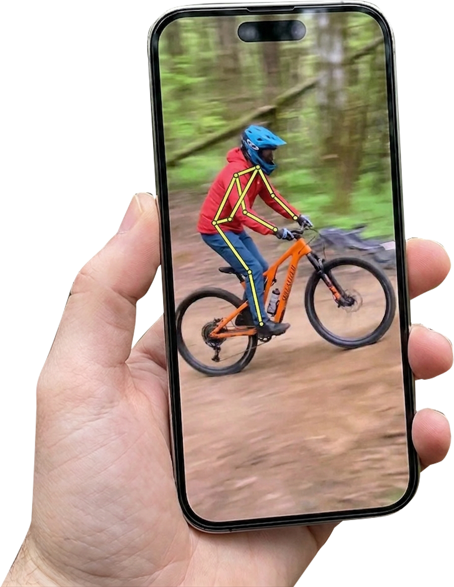 A hand holding a phone, RiderLens drawing the rider's body position on screen